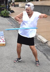 Judy Wright of Galveston tries out a hula hoop at the First Bank Texas booth.