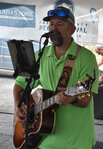 LD Whitehead entertains at one of two performance areas during the Peach Festival.